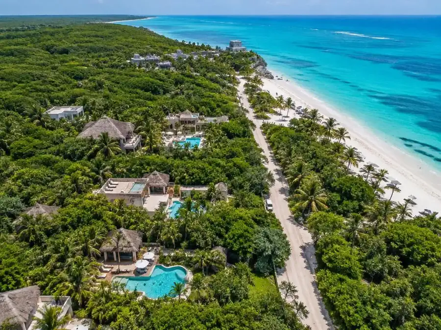 Aerial view of Tulum with jungle hotels inland and the beach road along the Caribbean